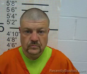 Booking photo from Warren County, Iowa