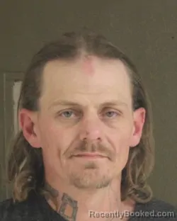 Mugshot of BRANDON M BENSON