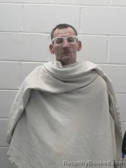 Mugshot of TRAVIS L EVANS