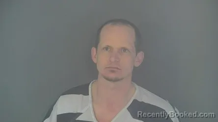 Mugshot of JUSTIN MICHAEL MCREYNOLDS