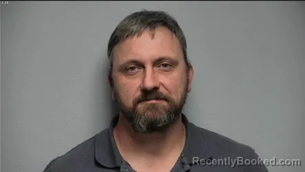 Mugshot of MICHAEL W HOWETT