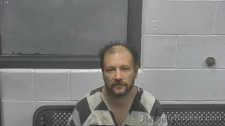 Mugshot of SCOTT A EVANS