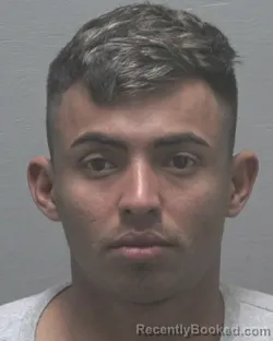 Mugshot of ELVIN CHIRINOS-RIVERS