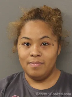 Mugshot of RMARI ROSARIO JACOME-BAXTER