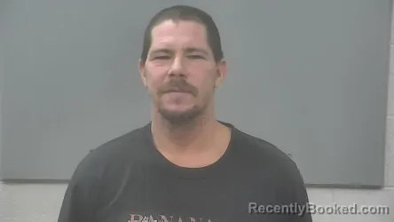 Mugshot of JUSTIN RAY MOORE