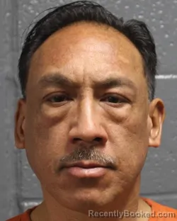 Mugshot of JOHNNY SUPNET RADA