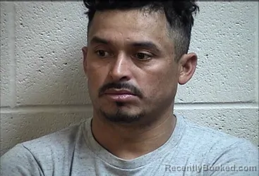 Mugshot of MERLIN ENRIQUE SANTOS