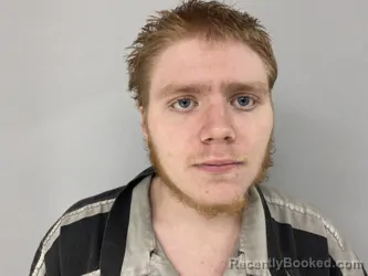 Mugshot of JUSTIN THOMPSON