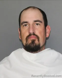 Mugshot of ZACHARY ALAN MENIKOS