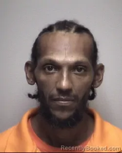 Mugshot of MARSHARIF RAYMUND FLORES