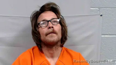 Mugshot of Oliver Lee Migner