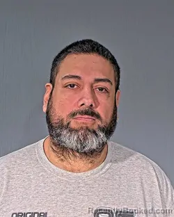 Mugshot of JUSTIN JEROME ENRIQUEZ