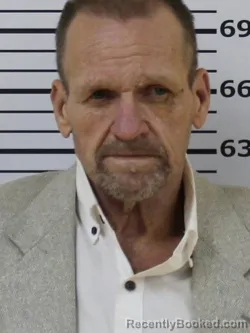 Mugshot of MILBURN B HUGHES