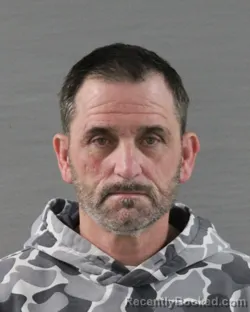 Mugshot of HARLTON EARL HANKINS