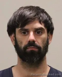 Mugshot of JUSTIN K CARTIER