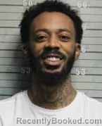 Mugshot of REGGIE MIKELL THOMPSON