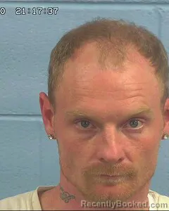 Mugshot of DANIEL REYNOLDS