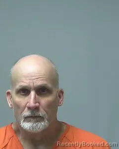 Mugshot of DENNIS COMALANDER