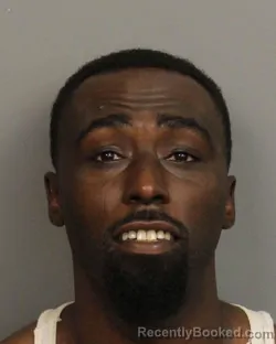 Mugshot of JUSTIN MICHAEL MOORE