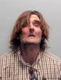 Mugshot of JUSTIN KELLY JOHNS