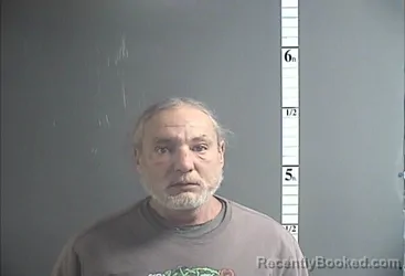 Mugshot of RAYMOND S COSSABOON