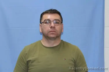 Mugshot of JORGE ELENES ANGULO